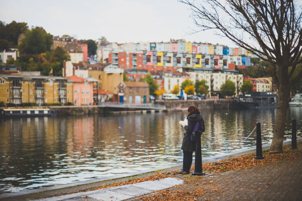 Woman reading on the harbourside