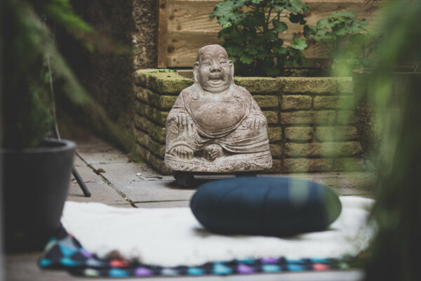 Stone Buddha in courtyard garden